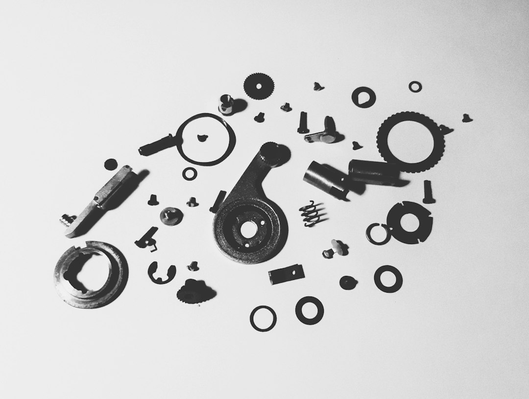 disassembled brake booster components laid out on a clean workbench