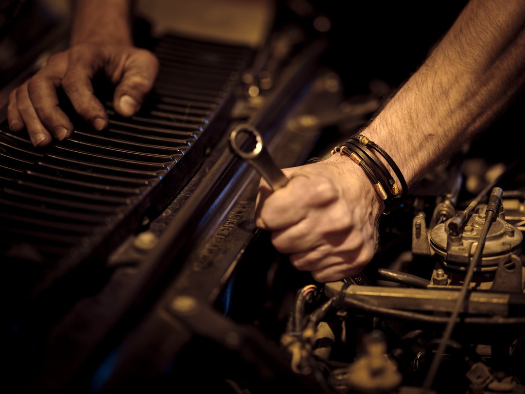 mechanic diagnosing a car air conditioning system