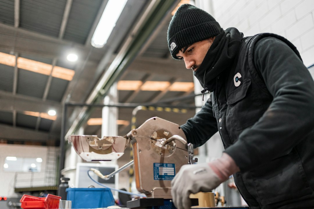 technician inspecting a vacuum brake booster